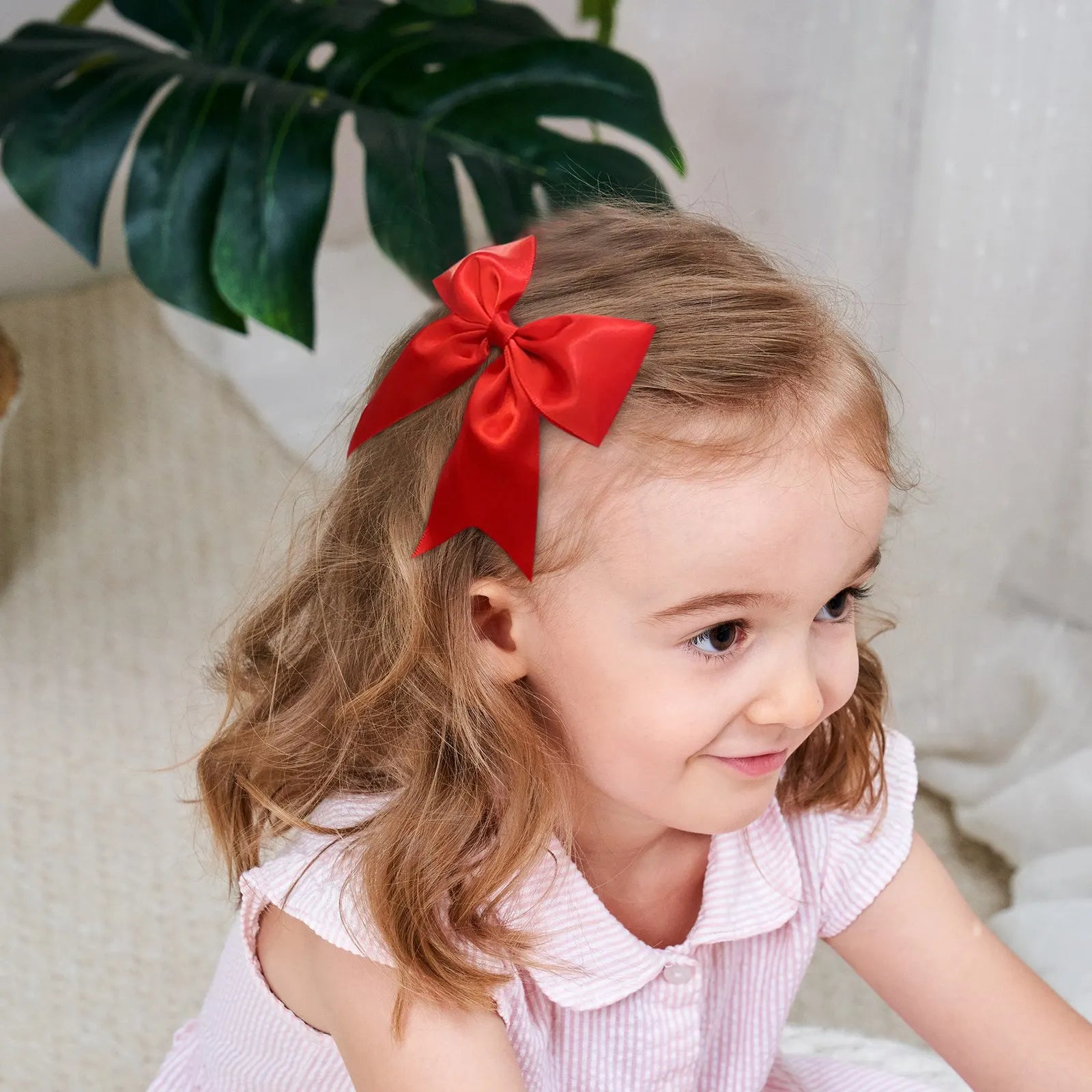 Baby wearing solid color hair bow clip